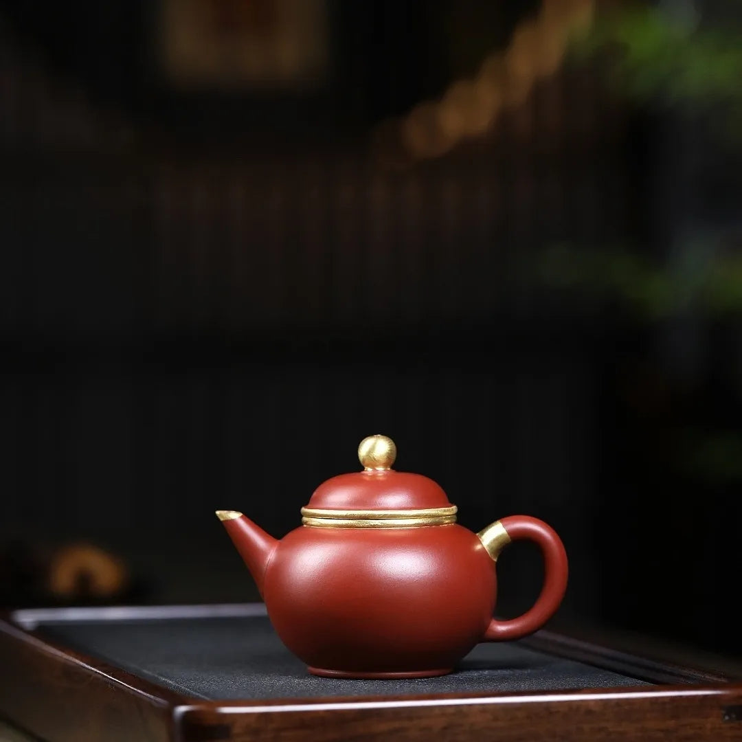 Product Name: Yixing Purple Clay Teapot - Masterfully Handcrafted Zhu Ni with Gold Outline, 200cc Capacity